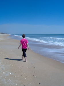 woman walking on beach